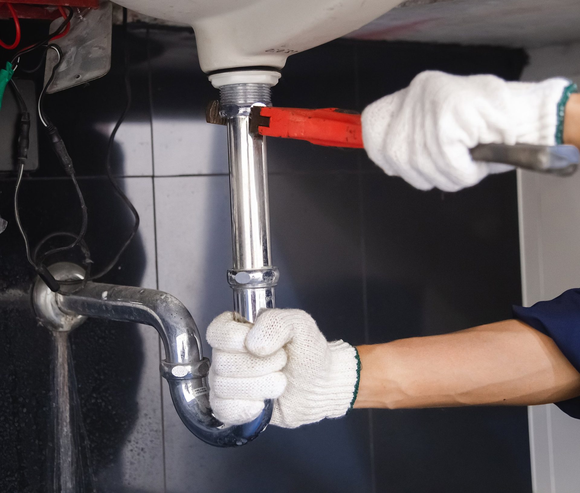 Restoration professional repairing the source of water damage